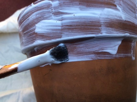 Napkin Decoupaged Flower Pot - brush Mod Podge on outside of the pot