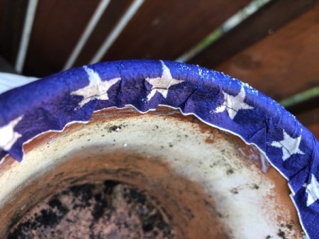 Napkin Decoupaged Flower Pot - fold napkin over and press into place