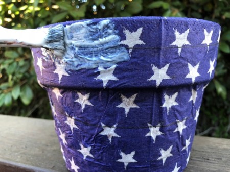 Napkin Decoupaged Flower Pot - apply an additional layer of Mod Podge to the outside of the pot