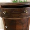 Value of a Mersman Demilune Table 4815 - half circle table with a drawer and storage area below
