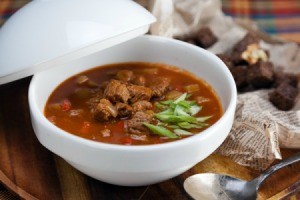 Goulash Soup in a white bowl.