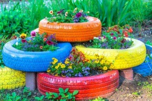Colorful Tires used as garden beds.