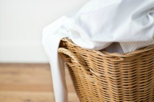 Sheets in a laundry basket.