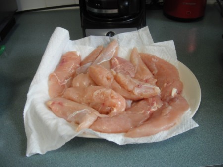 washed chicken on paper towels