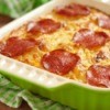 Cavatini in a casserole topped with pepperoni.
