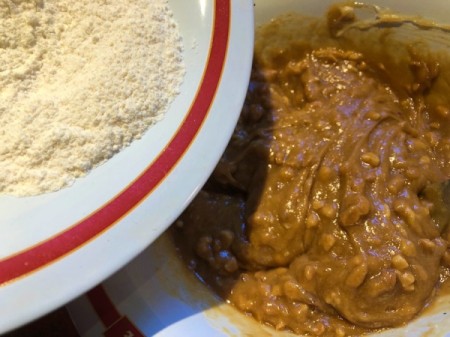adding flour to peanut butter and egg
