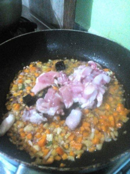 Chicken added to pan