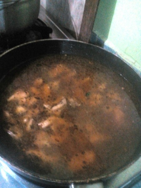 Chicken broth added to pan