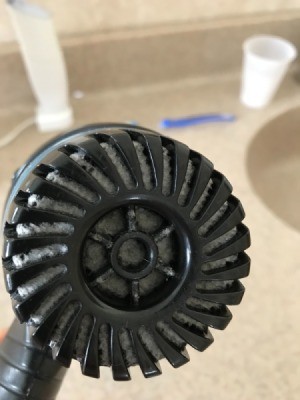 A dirty and clogged hair dryer.