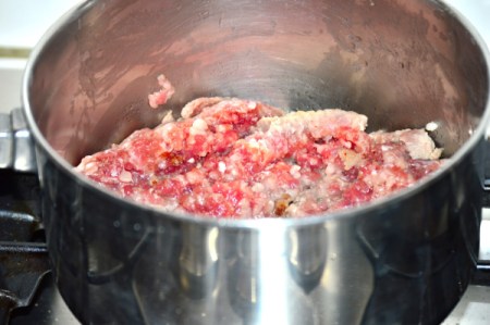 cooking sausage in pan