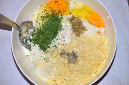 herbs and eggs with cheese in bowl