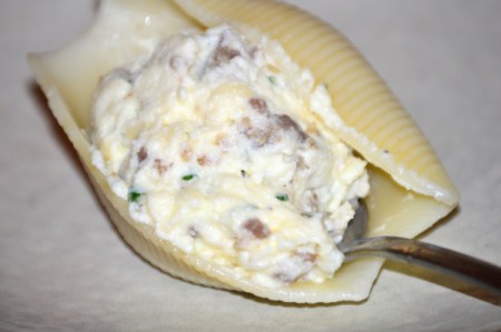 stuffing shells with cheese sausage mixture