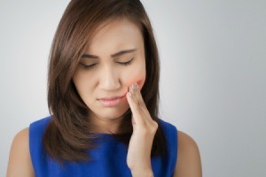 Woman with a toothache.