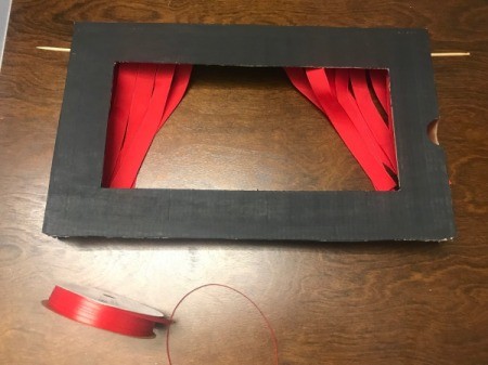How to Make a Shoebox Theater - ribbon curtain tied back at the sides