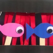How to Make a Shoebox Theater - two fish behind the stage