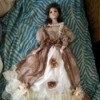 Identifying a Golden Keepsakes Doll  - doll wearing a long mauve dress with a white ruffled petticoat