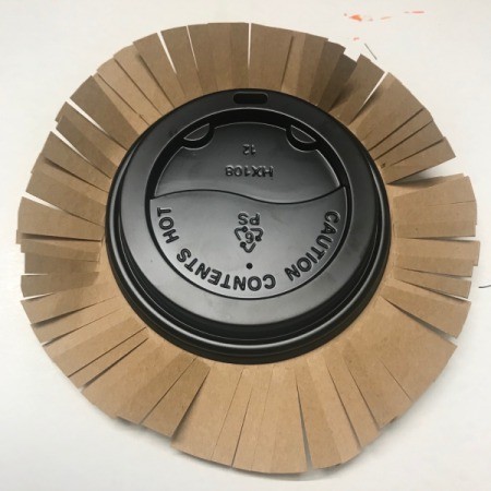 Recycled Coffee Lid Animals - test lid on top of fringed circle