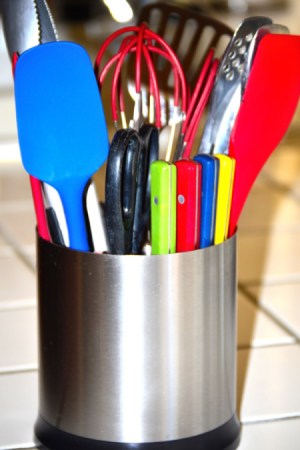 An organized kitchen utility crock.