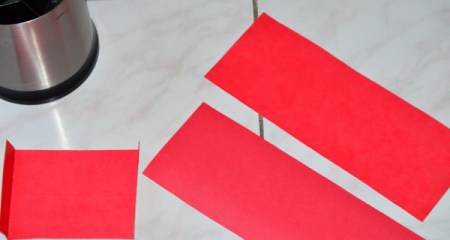 Pieces of cardstock cut from a hanging file folder.