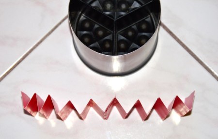Folded cardstock to be used to organize a kitchen utility crock.