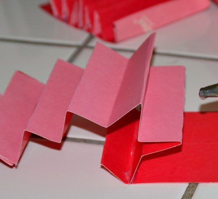 Folded cardstock to be used to organize a kitchen utility crock.