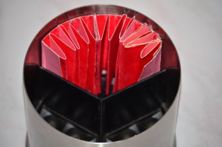Folded cardstock to be used to organize a kitchen utility crock.