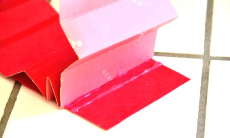 Folded cardstock to be used to organize a kitchen utility crock.