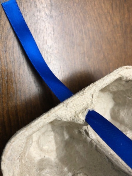 Egg Carton Sail Boat - insert ribbon through the hole and secure with a knot