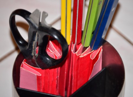 An organized kitchen utility crock.