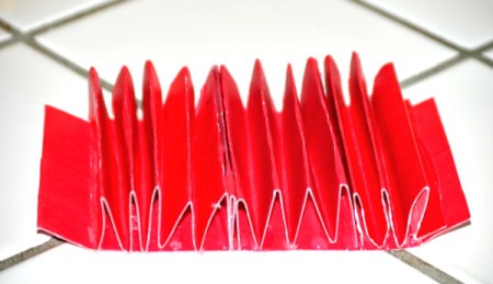 Folded cardstock to be used to organize a kitchen utility crock.