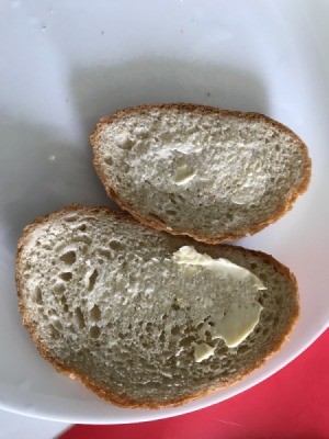 Two slices of bread with butter.