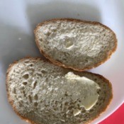 Two slices of bread with butter.