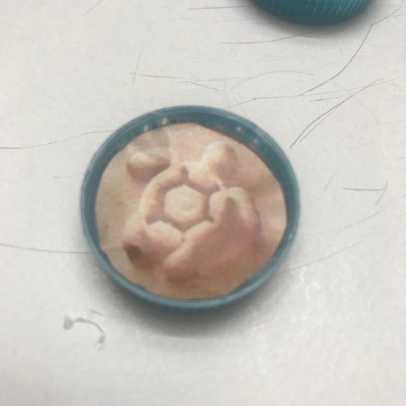 Matching Game Made with Water Bottle Caps - stick image inside