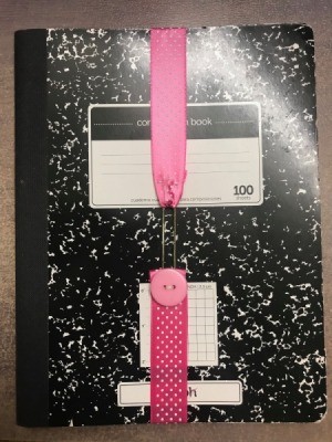 Ribbon Bookmark - ribbon stretched over a composition book
