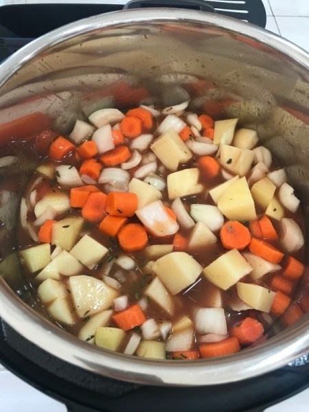 vegetables added to pot