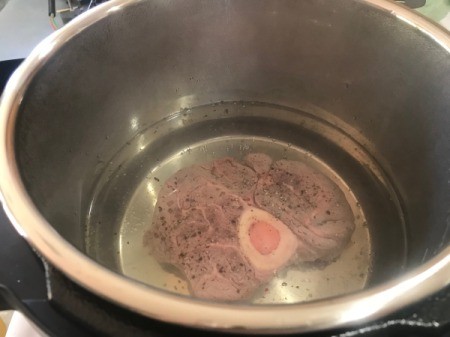 meat added to water in Instant Pot