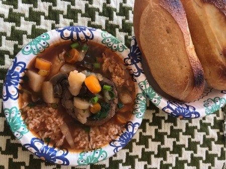 bowl of soup over rice