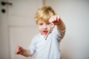 Toddler with an old key.