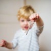 Toddler with an old key.