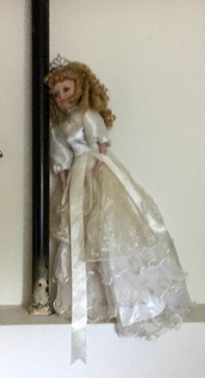 Identifying a Porcelain Doll - doll wearing a long white dress and a tiara