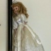 Identifying a Porcelain Doll - doll wearing a long white dress and a tiara
