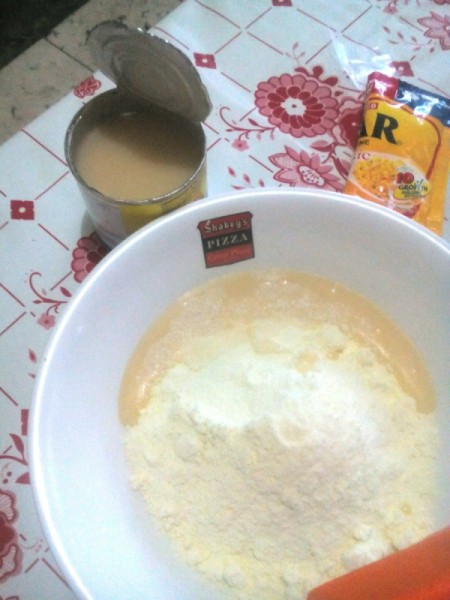 adding condensed milk to powdered sugar