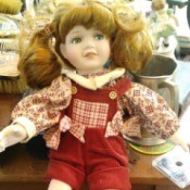 Identifying a Porcelain Doll - doll wearing overalls