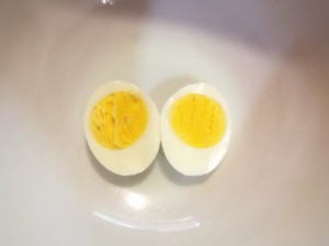 A hard boiled egg cut in half.