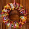 Color Explosion Summer Wreath - finished paper liner wreath hanging on a door