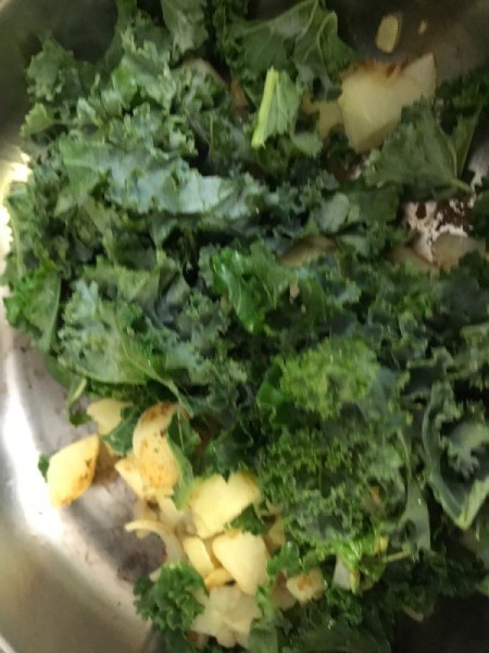 Kale added to pan