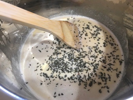 milk, cream and basil in pot