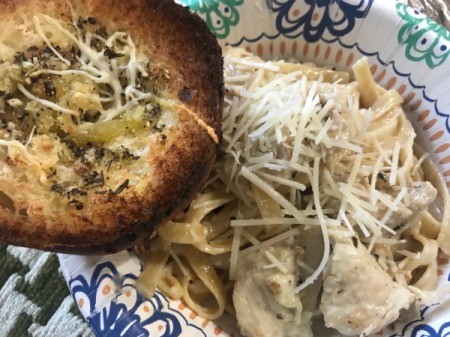 plate of fettuccine alfredo and garlic bread