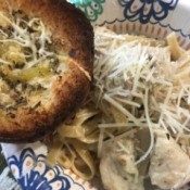 plate of fettuccine alfredo and garlic bread