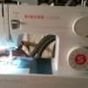 Feed Dog on Singer Sewing Machine Not Working - white plastic housing sewing machine